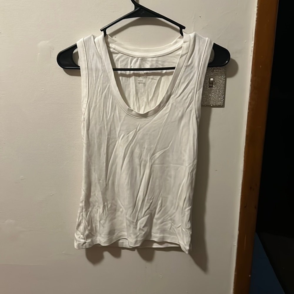 White tank top. Been in drawer for a long time